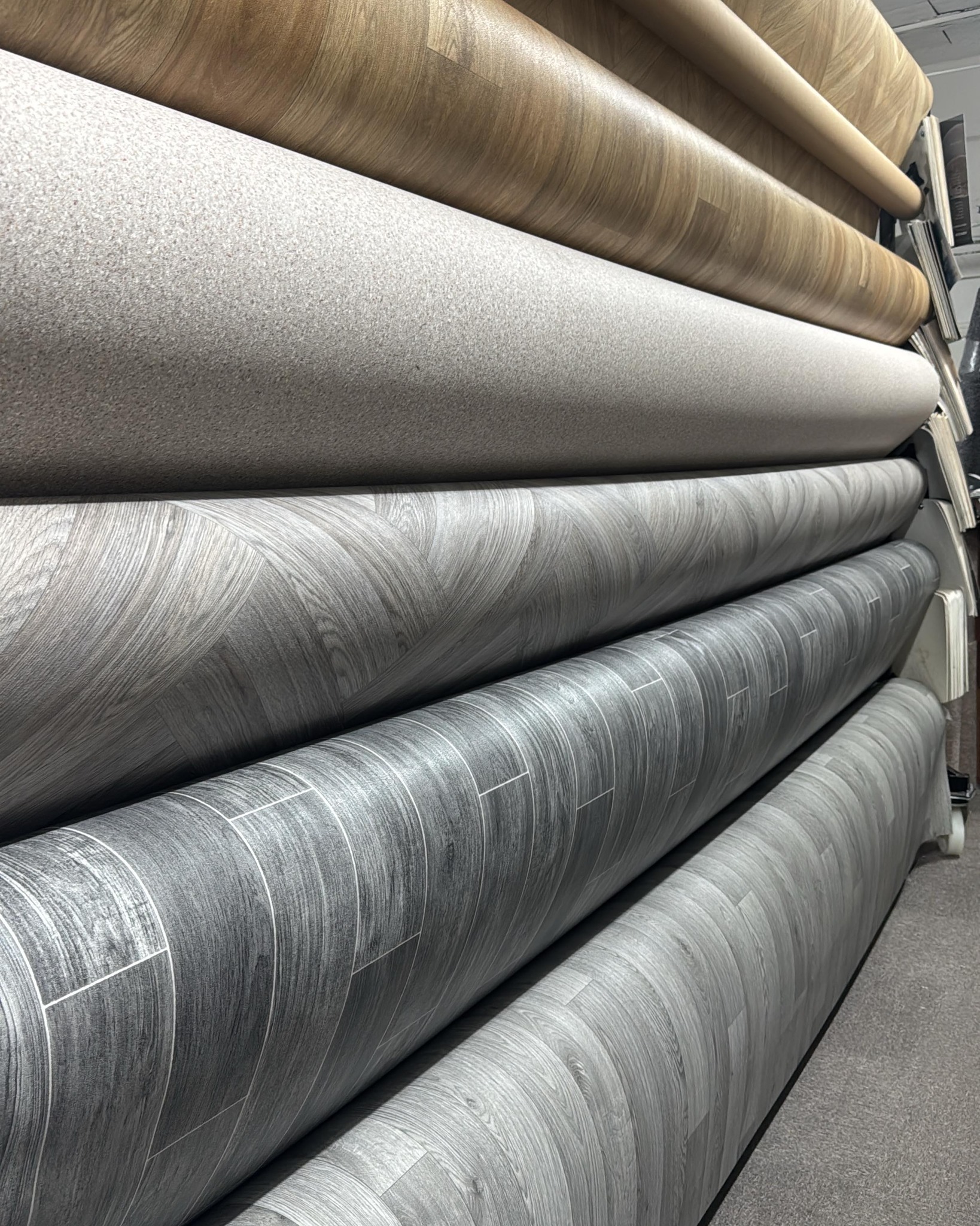 Vinyl and wood flooring rolls in the showroom