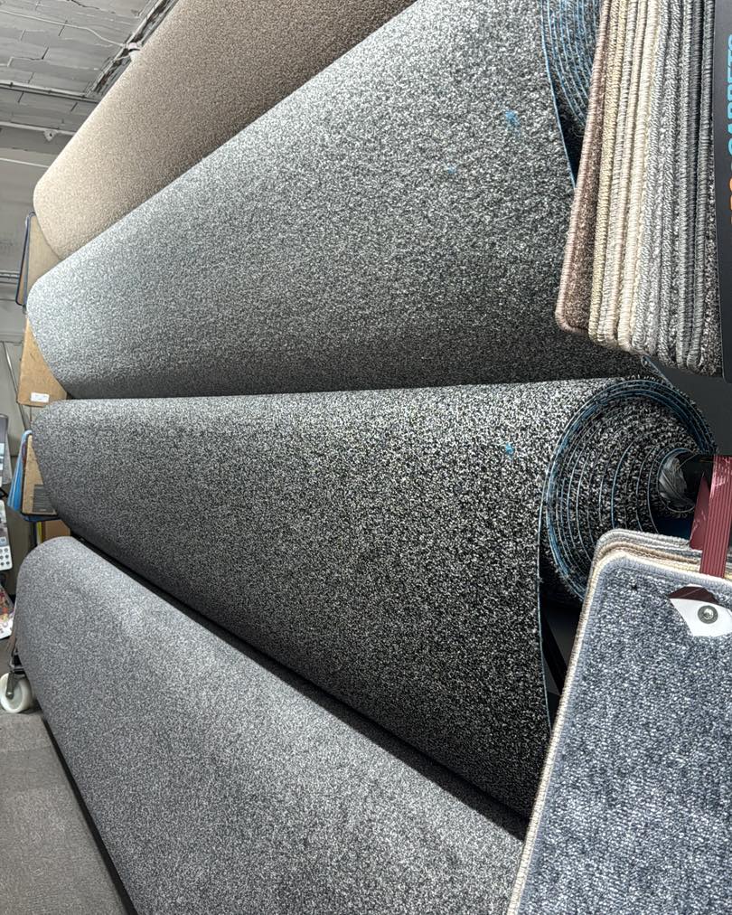 Dark carpet rolls display