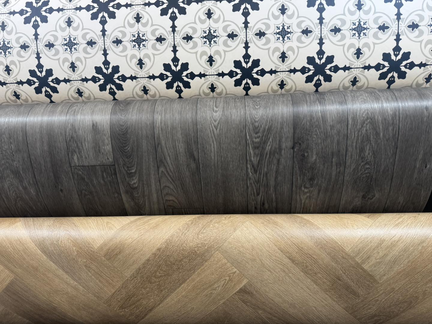 Patterned vinyl tiles and wood flooring